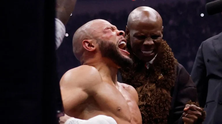 Chris Eubank Jr celebrates with his father Chris Eubank Sr after defeating Conor Benn at Tottenham Hotspur Stadium.