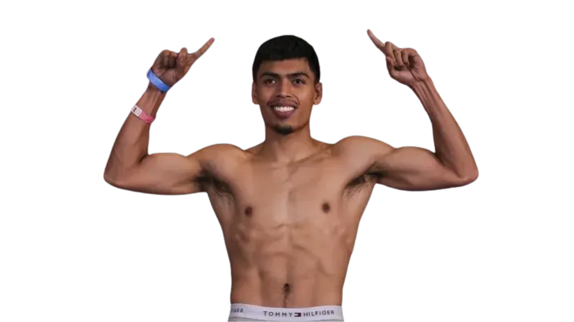 Angelo Leo with arms raised in victory, smiling before a boxing match