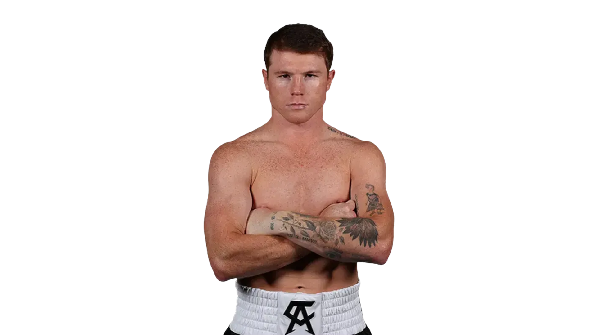 Canelo Álvarez standing shirtless with arms crossed, showing tattoos.