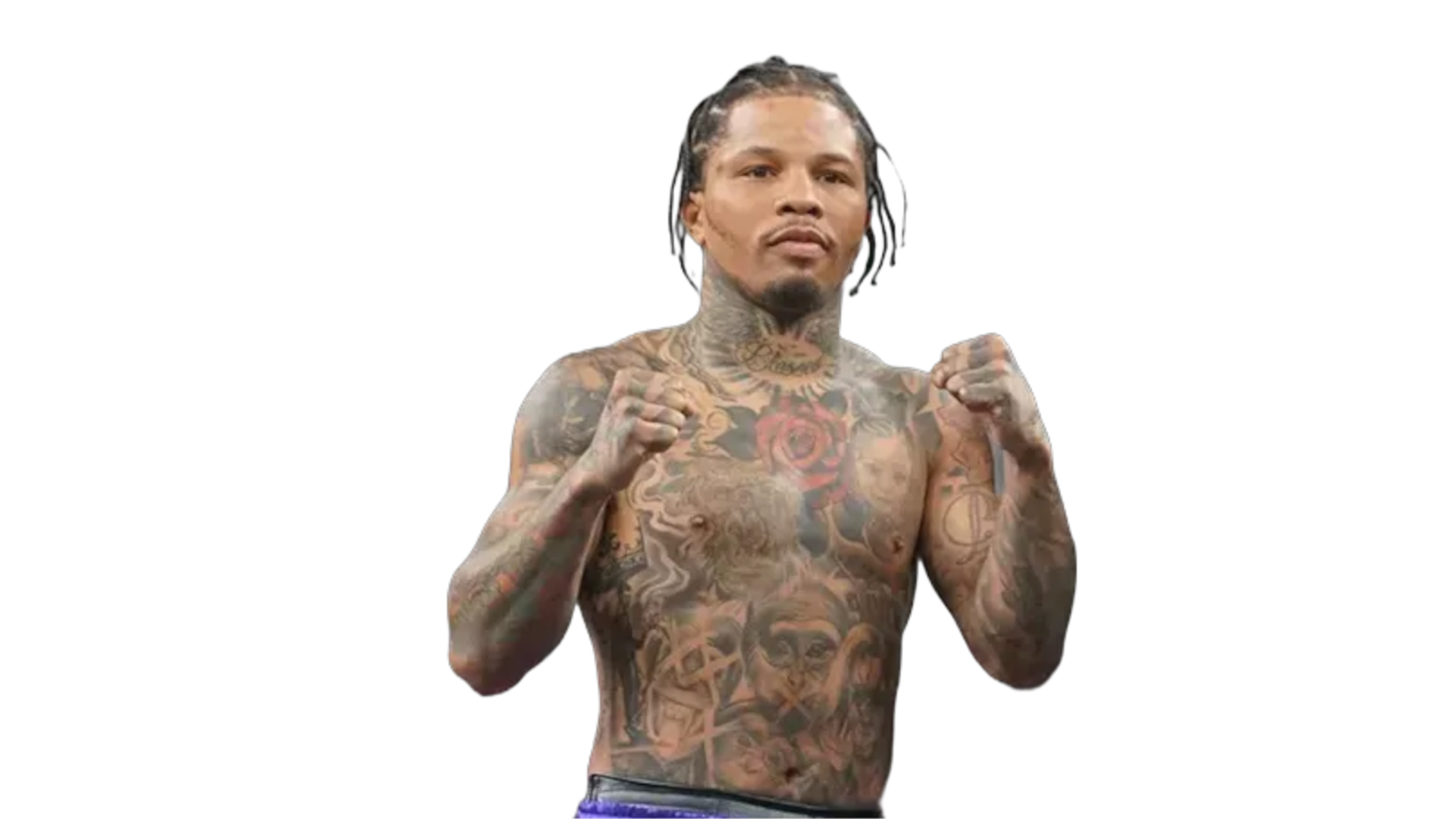 Gervonta Davis in boxing stance with fists raised, showing tattooed torso.