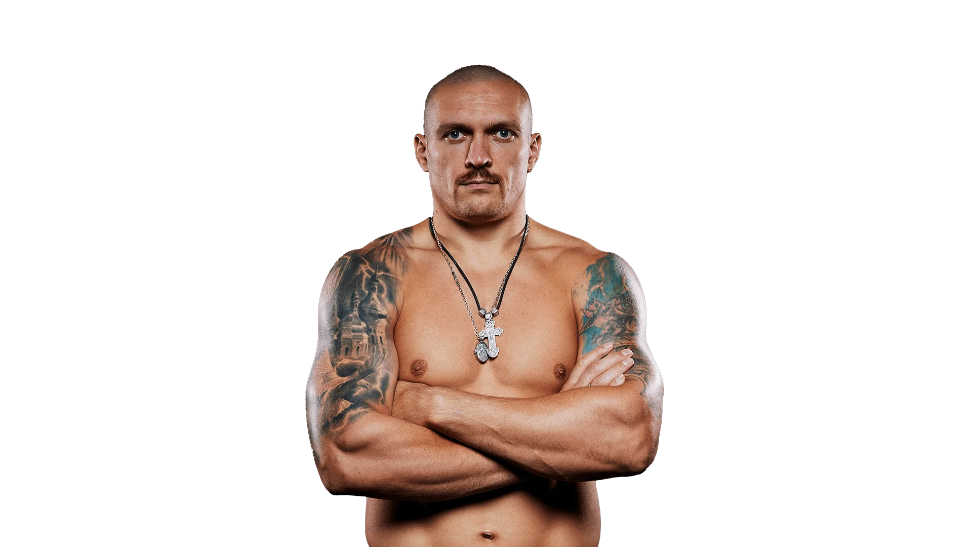 Oleksandr Usyk shirtless with arms crossed, showing tattoos and confidence
