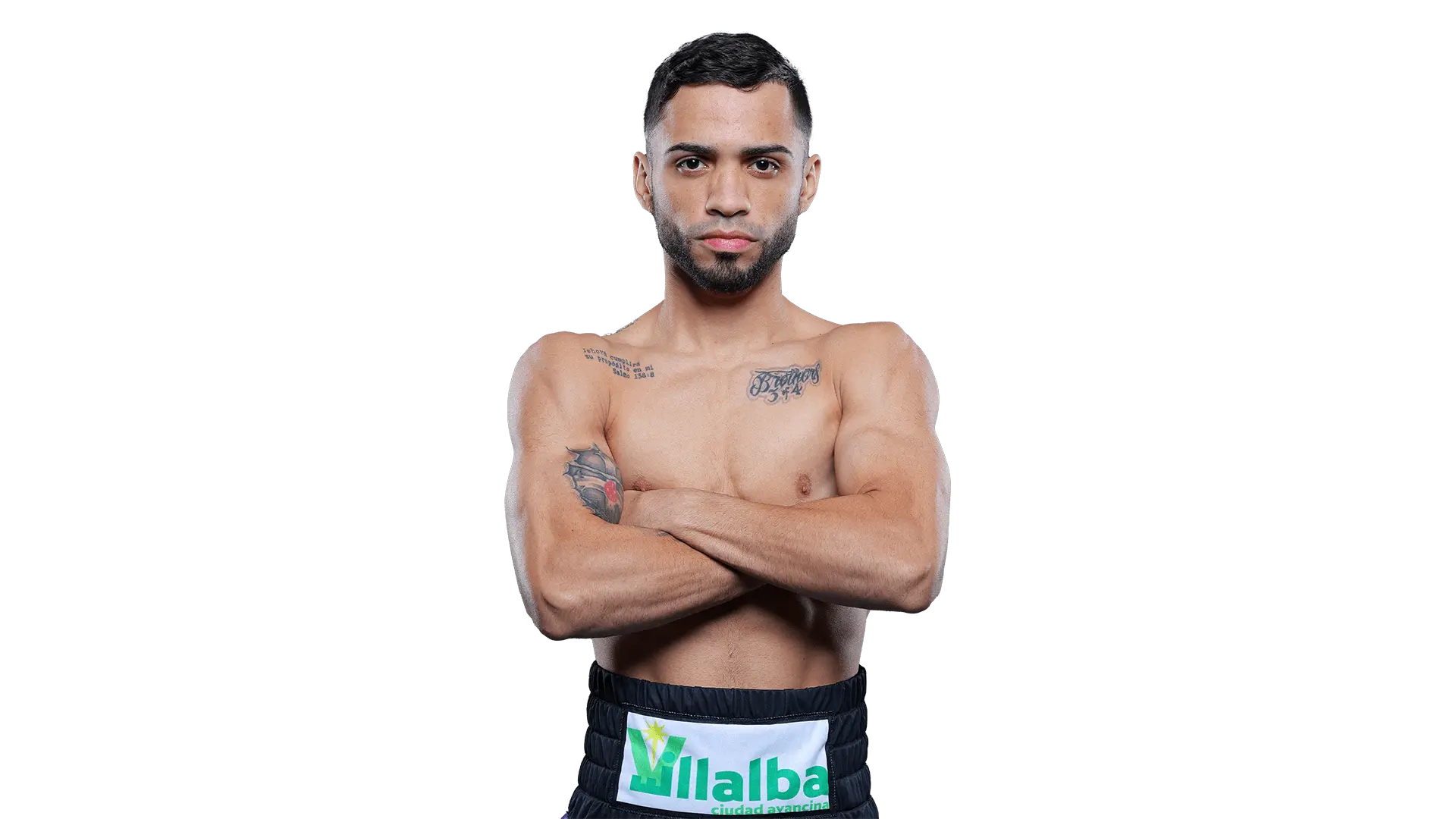 Oscar Collazo stands with arms crossed, showing tattoos and focus.