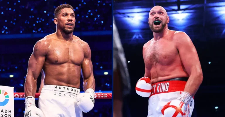 Anthony Joshua and Tyson Fury in the boxing ring, side by side, both wearing gloves and fight trunks under arena lights.