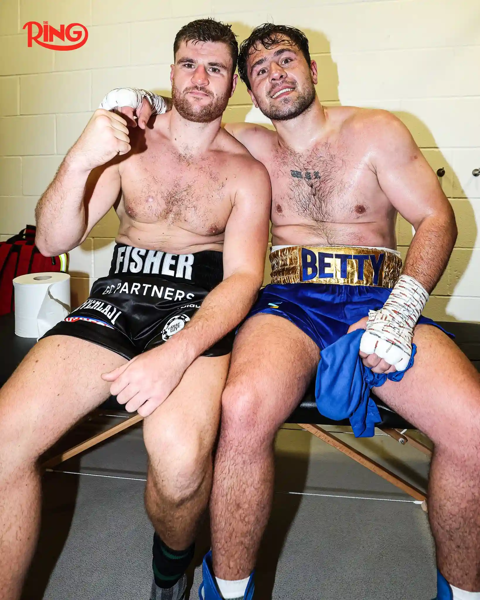 Johnny Fisher and Dave Allen smile together post-fight after their heavyweight clash at the Copper Box Arena on 17 May 2025.