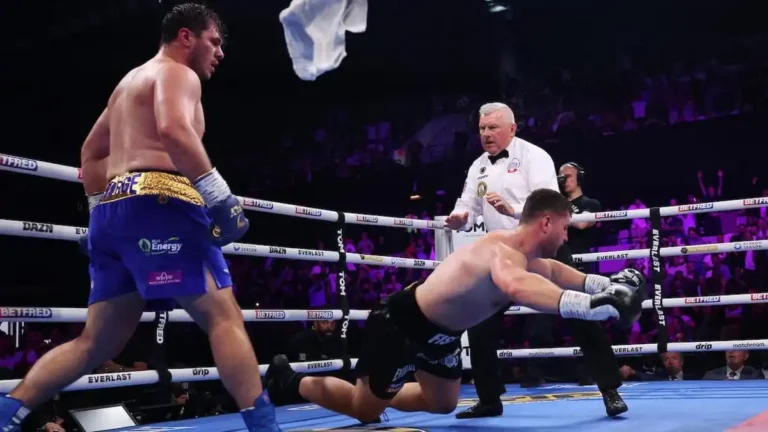 Dave Allen knocks out Johnny Fisher in the fifth round at the Copper Box Arena as the referee stops the fight.