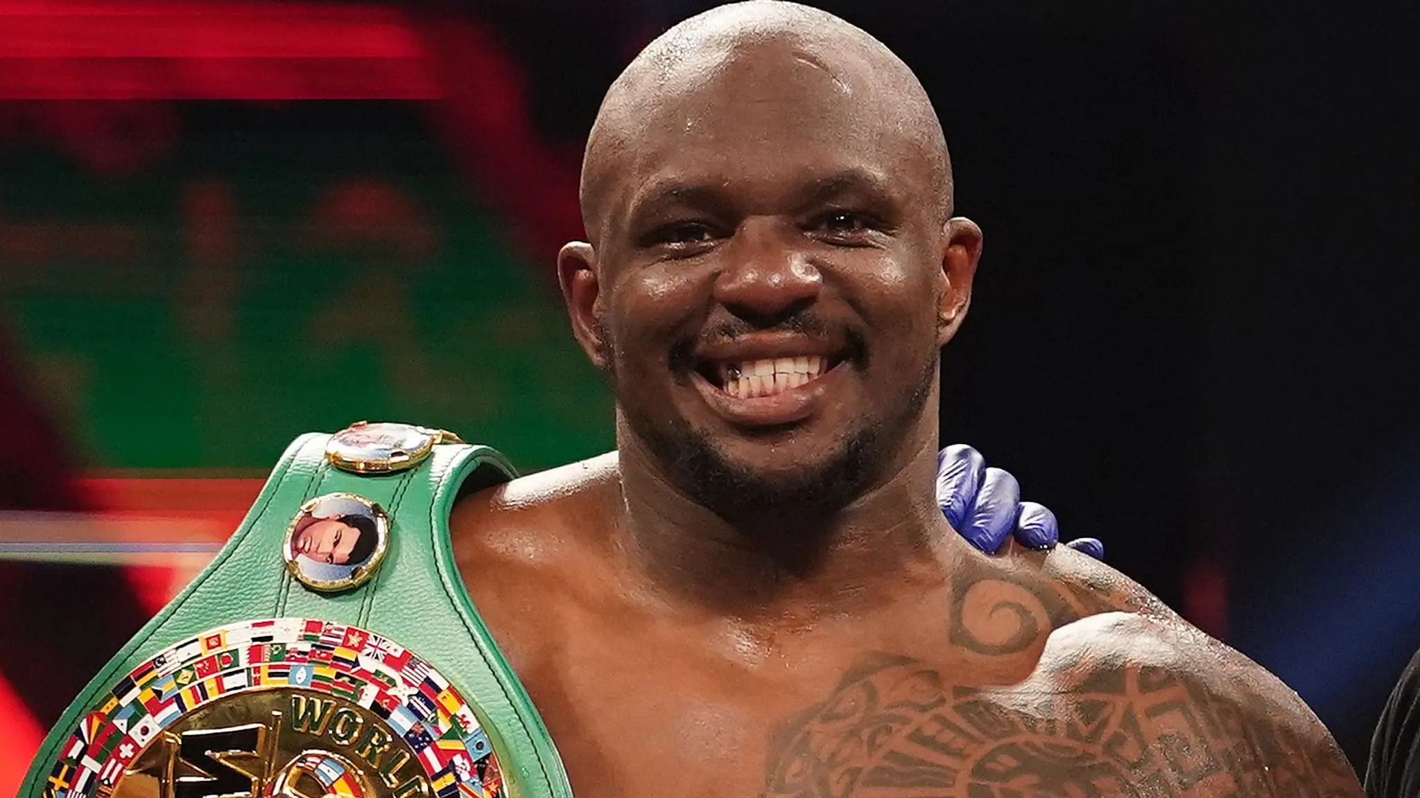Dillian Whyte smiles with WBC belt after heavyweight boxing victory