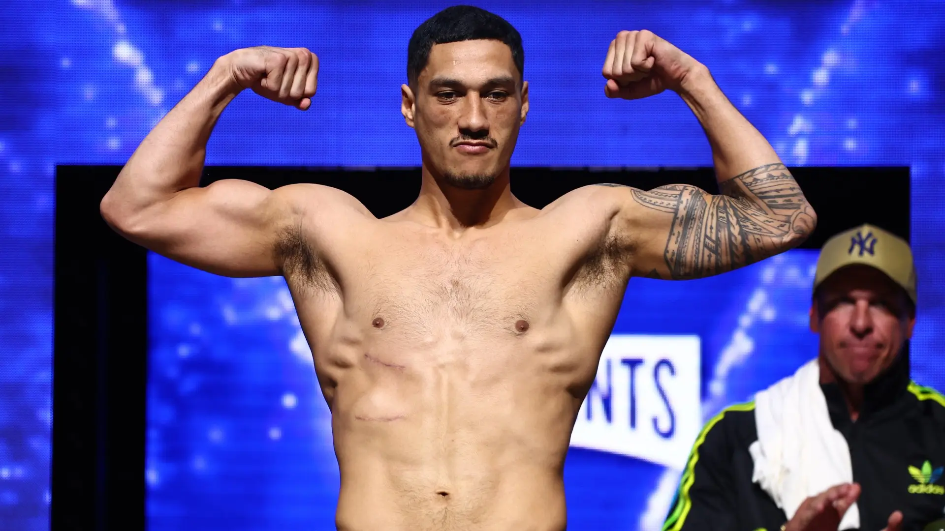 Jai Opetaia flexes during weigh-in ahead of cruiserweight boxing match