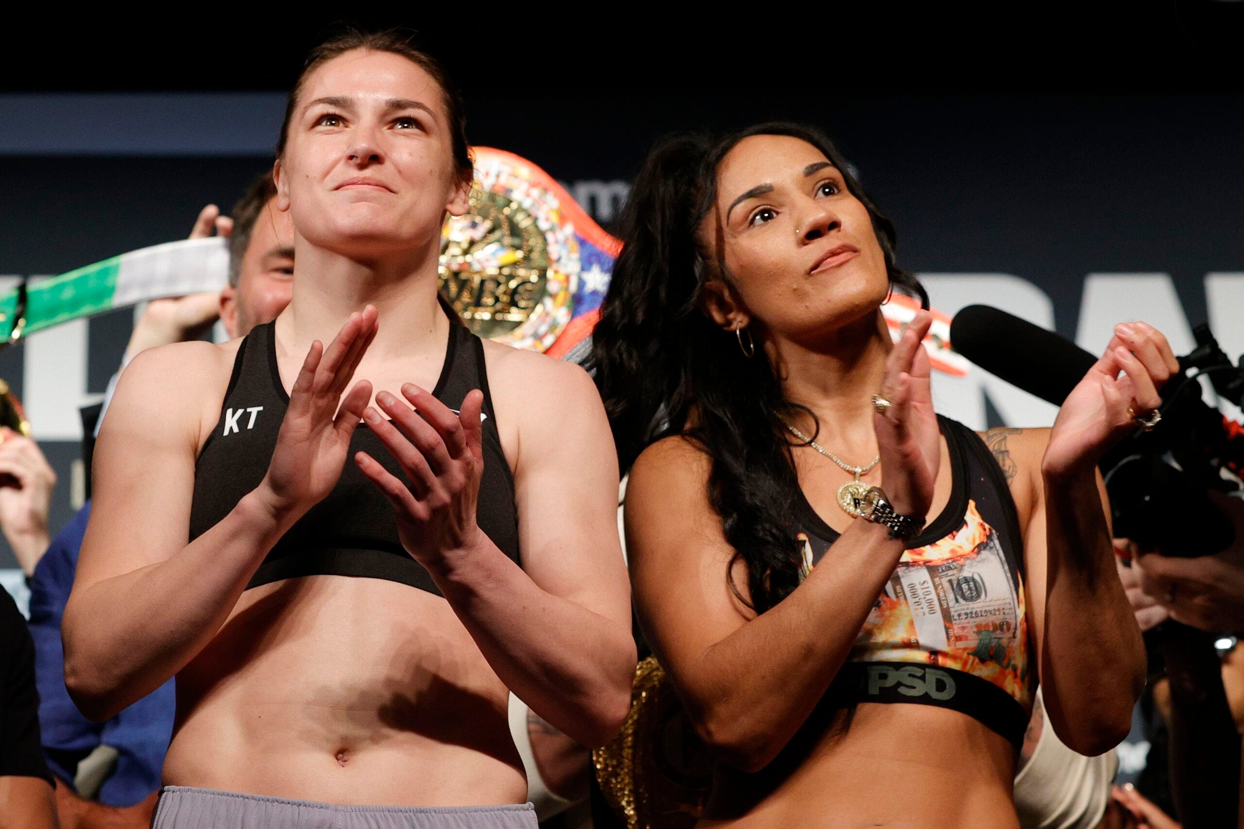 Katie Taylor and Amanda Serrano applauding during weigh-in event ahead of their third fight at Madison Square Garden