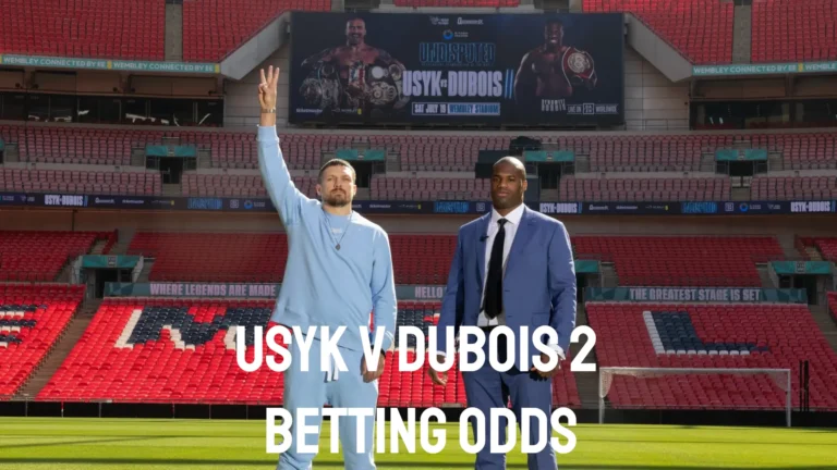 Oleksandr Usyk and Daniel Dubois pose at Wembley Stadium with their rematch banner in the background.