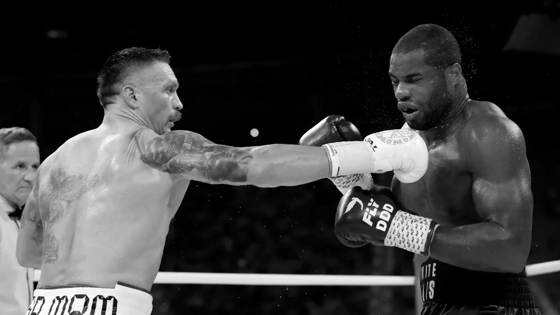 Oleksandr Usyk vs Daniel Dubois face-off promotional image for heavyweight boxing match.